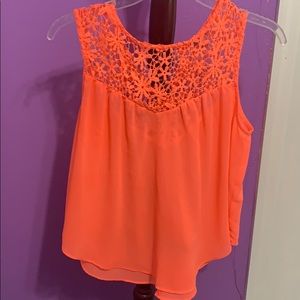 A pink shirt with no sleeves *ONLY WORN ONCE*